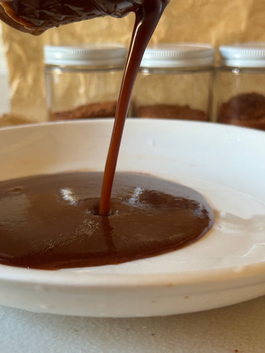  Barbecue Sauce being poured onto a plate after rehydrating from freeze dried powder