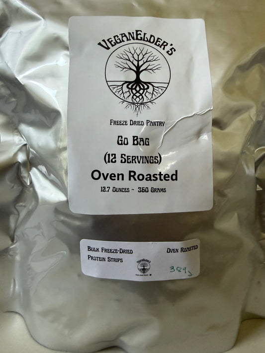 A silver foil bag of Veganelder's bulk freeze-dried protein strips, oven roasted, with two white labels on a light beige background.