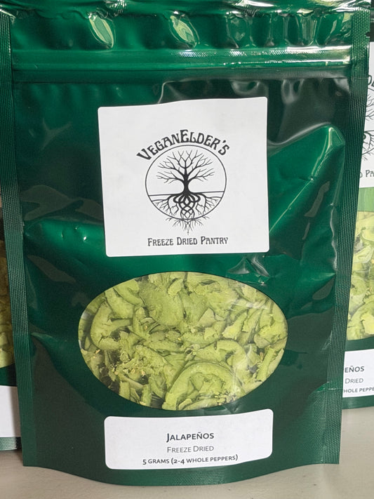 Green pouch of VeganElder's Freeze Dried Pantry freeze dried jalapeños with a label stating 5 grams of product which amounts to 2 to 4 fresh peppers 