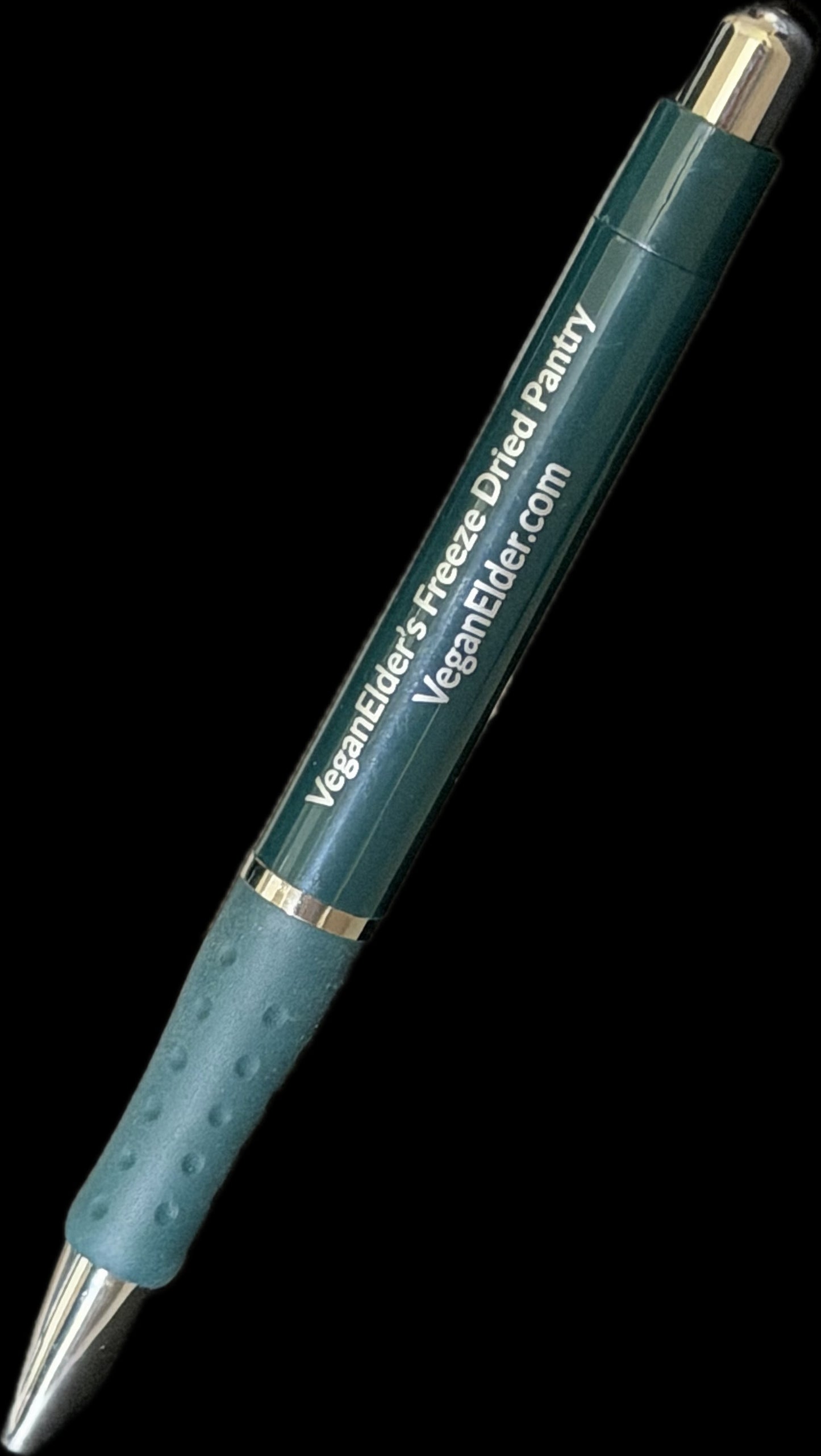 Green Pen with rubberized grip and push button click retractable ballpoint pen with text 'VeganElder's Freeze Dried Pantry' and website 'veganelder.com' in gold font and green plastic barrel of pen
