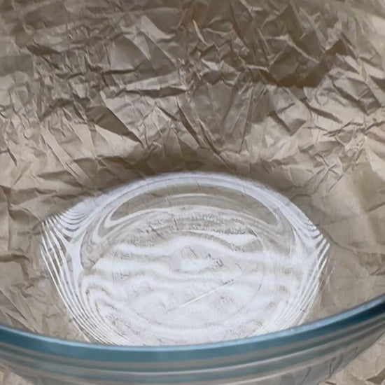 Video of plant protein strips in a bowl being rehydrated with water.